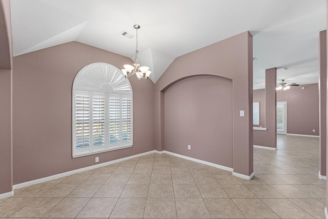 tiled empty room featuring ceiling fan with notable chandelier and vaulted ceiling