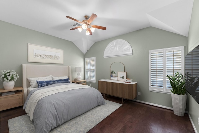 bedroom with ceiling fan, dark hardwood / wood-style flooring, and vaulted ceiling