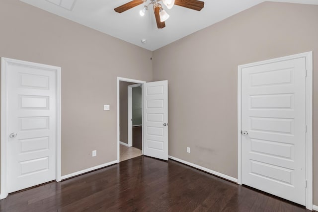 unfurnished bedroom featuring ceiling fan, dark hardwood / wood-style flooring, and lofted ceiling