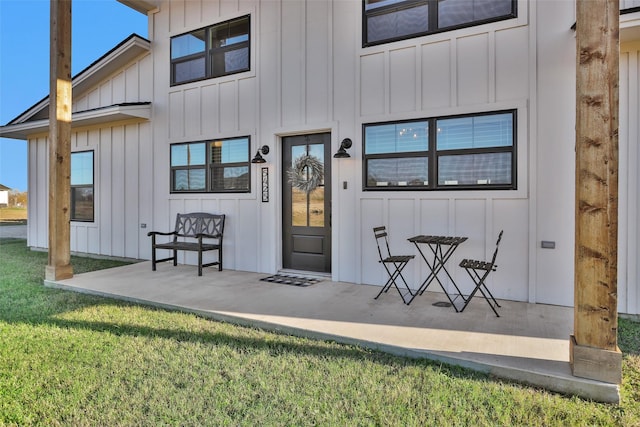 doorway to property with a yard