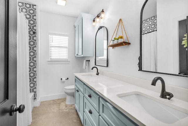 full bathroom with vanity, shower / bath combination with curtain, and toilet