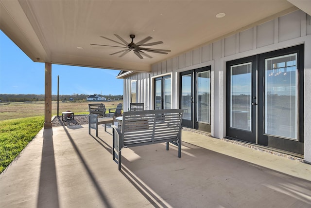 view of patio with outdoor lounge area and ceiling fan