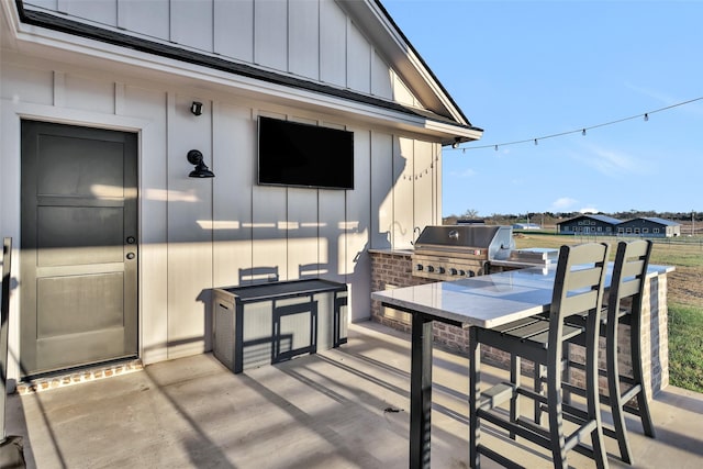 view of patio / terrace featuring exterior kitchen