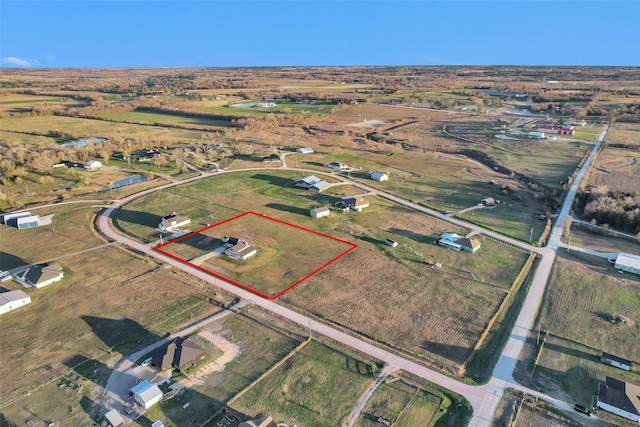 birds eye view of property featuring a rural view