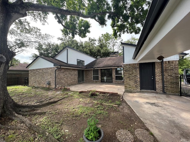 rear view of house with a patio area