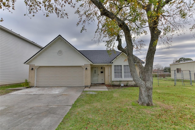 single story home with a garage and a front yard