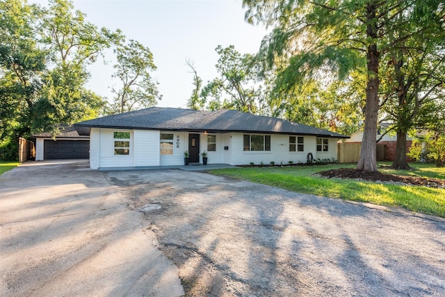 single story home with an outbuilding and a garage