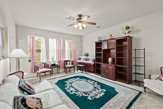 sitting room featuring ceiling fan