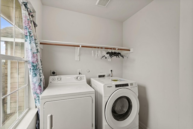 clothes washing area with independent washer and dryer