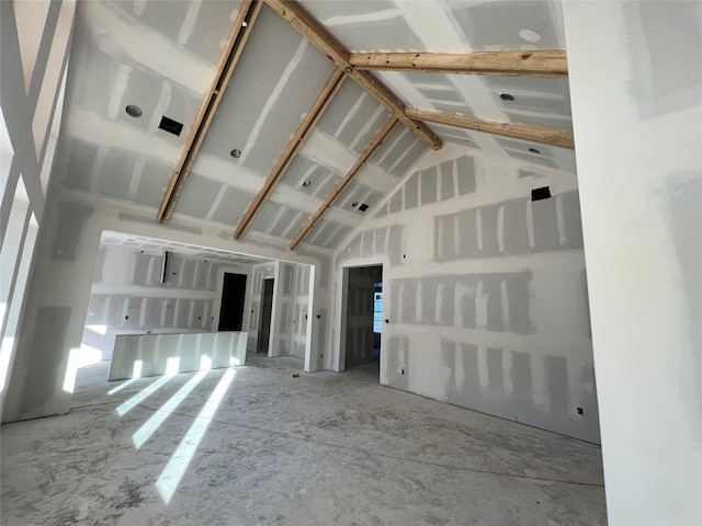 spare room with vaulted ceiling