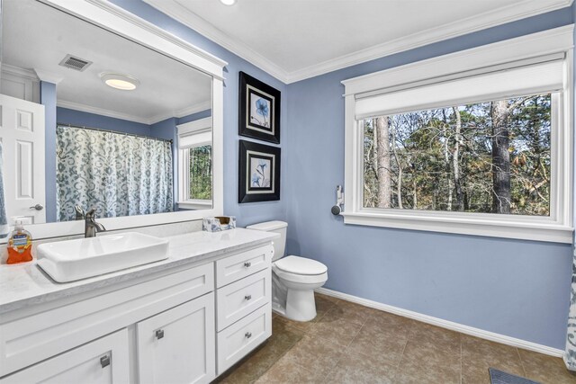 bathroom featuring vanity, toilet, and ornamental molding