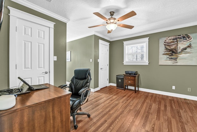 office space with crown molding, hardwood / wood-style floors, a textured ceiling, and ceiling fan