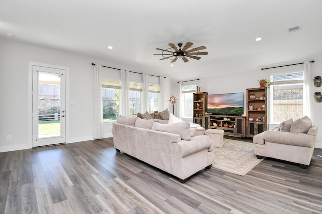 living room with hardwood / wood-style floors and ceiling fan