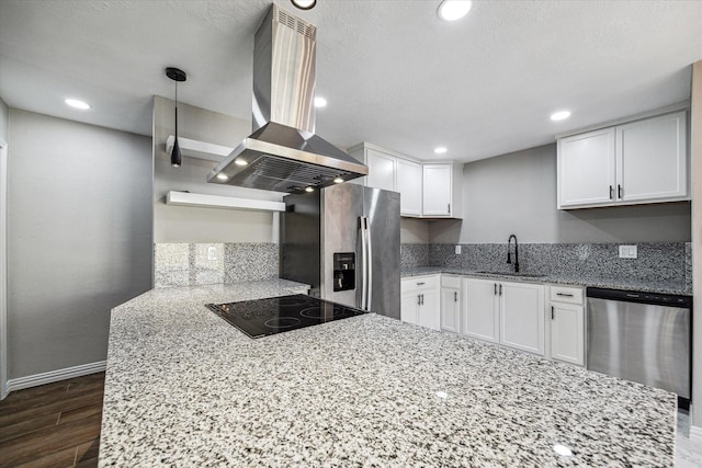 kitchen featuring island exhaust hood, appliances with stainless steel finishes, light stone countertops, sink, and white cabinets