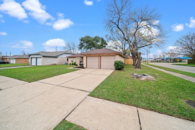 ranch-style home with a garage and a front yard