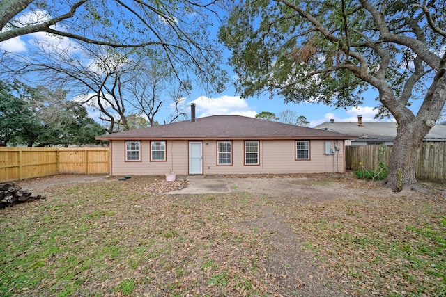 back of property with a patio