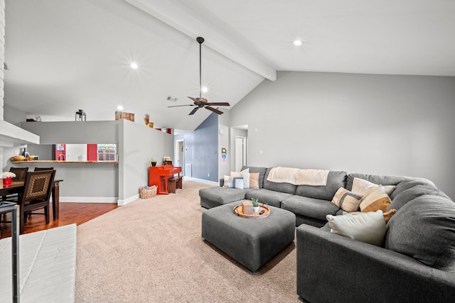 living room with vaulted ceiling with beams, ceiling fan, and light hardwood / wood-style flooring