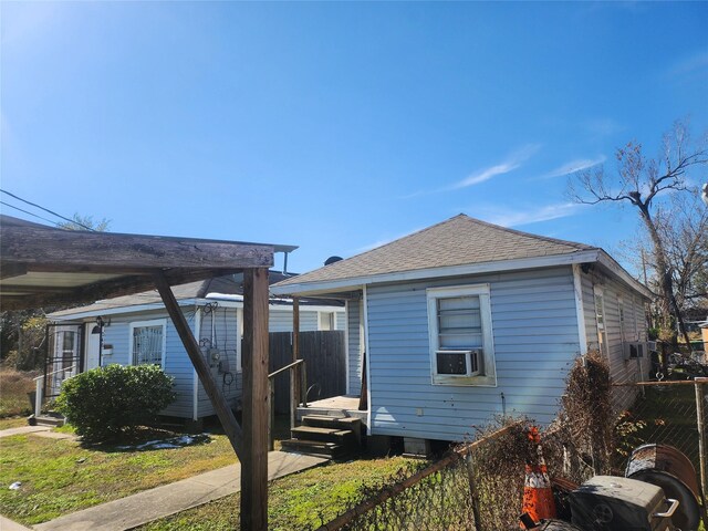 view of side of home with cooling unit