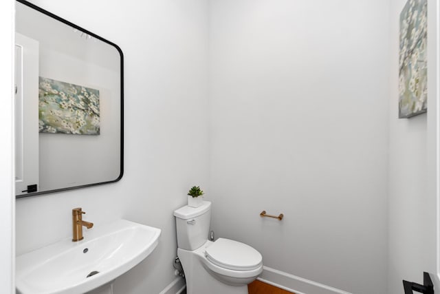 bathroom with toilet and sink