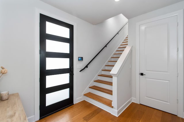 foyer entrance with hardwood / wood-style floors