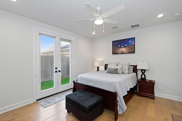 bedroom with multiple windows, access to outside, ceiling fan, and light hardwood / wood-style floors