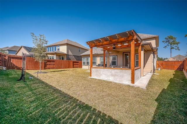 rear view of property featuring a yard and a pergola