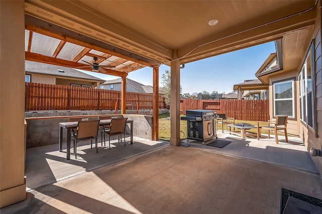 view of patio featuring ceiling fan