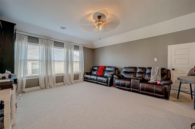 carpeted living room featuring ceiling fan and baseboard heating