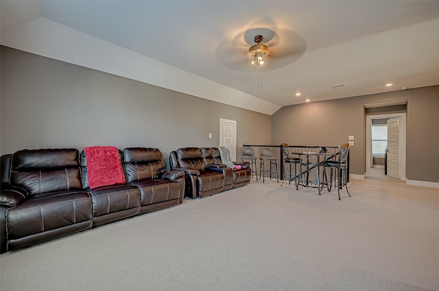 living room featuring ceiling fan, carpet, and lofted ceiling