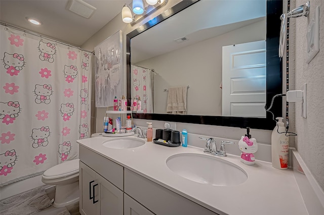 bathroom with a shower with shower curtain, vanity, and toilet