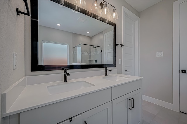 bathroom with vanity, tile patterned floors, and a shower with door