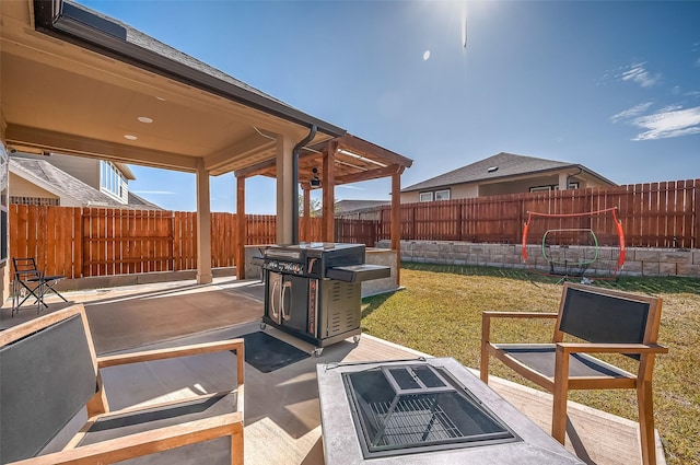 view of patio featuring a fire pit