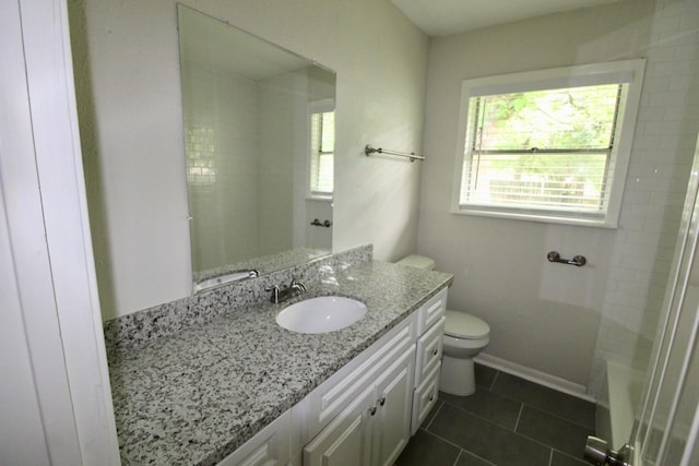 bathroom featuring tile patterned floors, vanity, and toilet