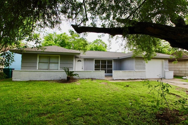 ranch-style home with a garage and a front lawn