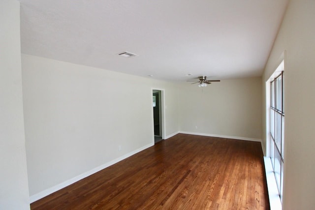 empty room featuring hardwood / wood-style flooring and ceiling fan