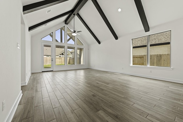 16710 Yaklin Meadow Ct, Humble, TX 77346 - unfurnished living room with beamed ceiling, ceiling fan, wood finished floors, recessed lighting, and high vaulted ceiling