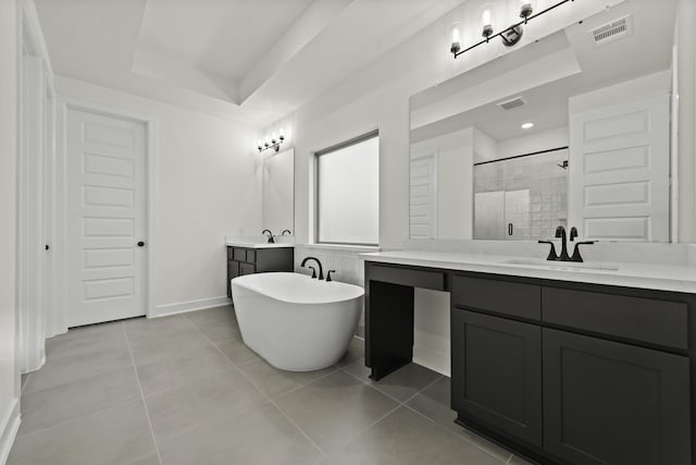 16710 Yaklin Meadow Ct, Humble, TX 77346 - bathroom featuring a stall shower, vanity, a freestanding tub, tile patterned floors, and a tray ceiling