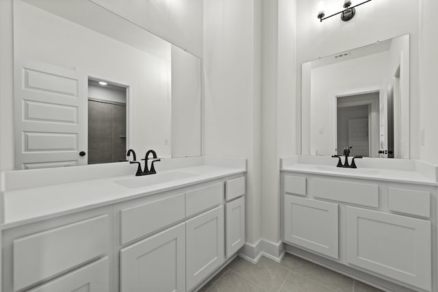 16710 Yaklin Meadow Ct, Humble, TX 77346 - full bathroom with two vanities and tile patterned flooring