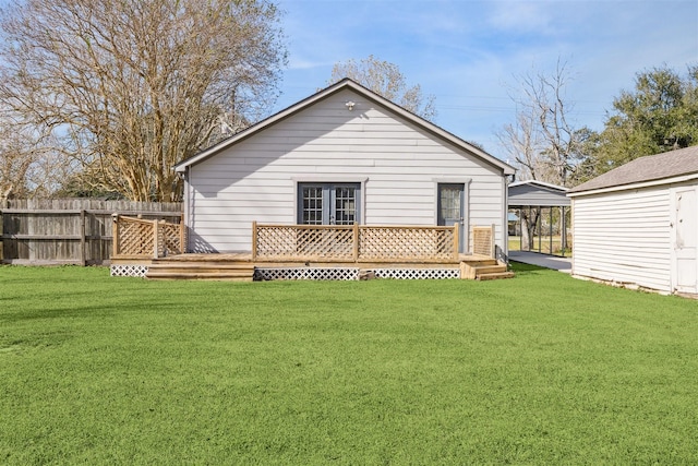 back of house with a lawn and a storage shed