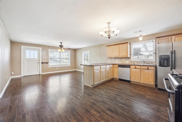 kitchen with kitchen peninsula, decorative backsplash, dark hardwood / wood-style flooring, stainless steel appliances, and light brown cabinets