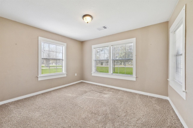 spare room featuring carpet floors