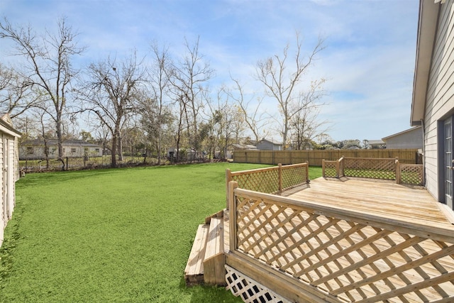 view of yard featuring a wooden deck