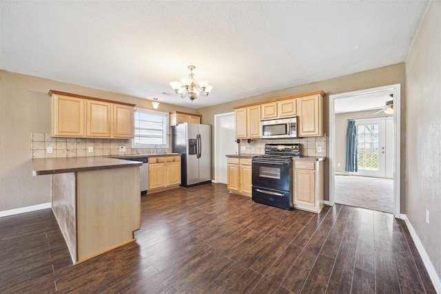 kitchen with light brown cabinetry, pendant lighting, dark hardwood / wood-style floors, and appliances with stainless steel finishes