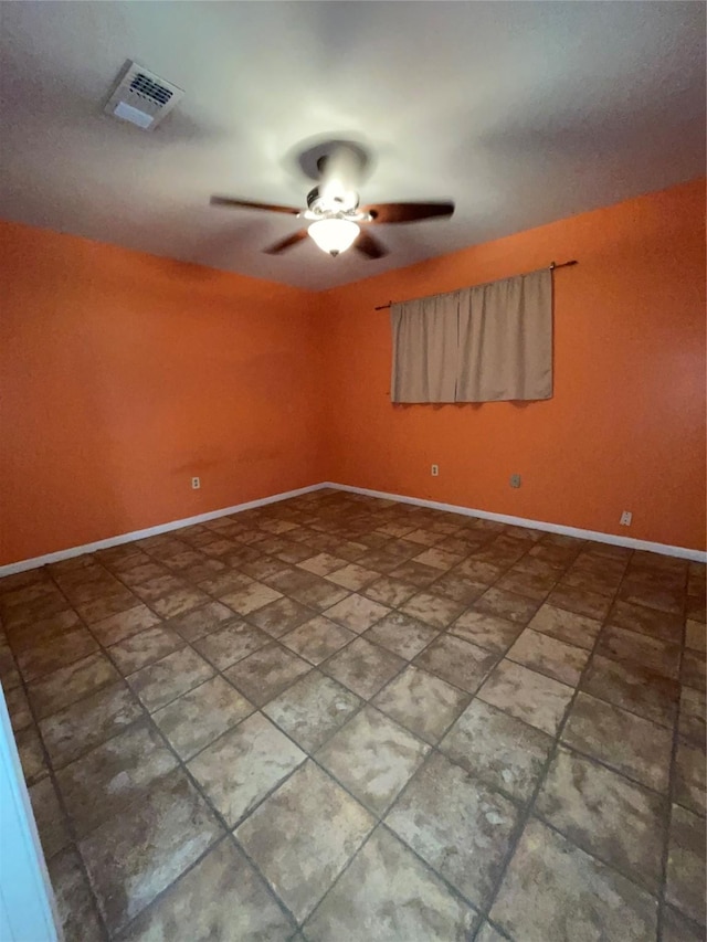 unfurnished room with ceiling fan