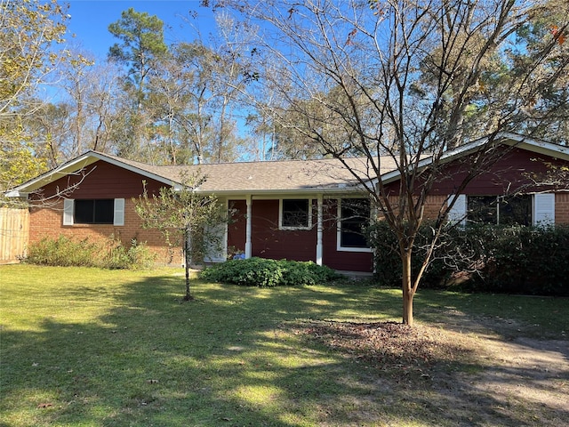 single story home featuring a front lawn