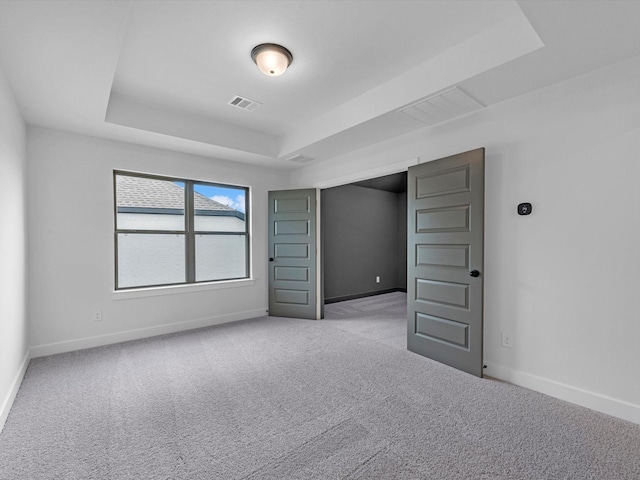 3248 Stingray Cove Dr, Katy, TX 77493 - carpeted spare room with visible vents, baseboards, and a raised ceiling