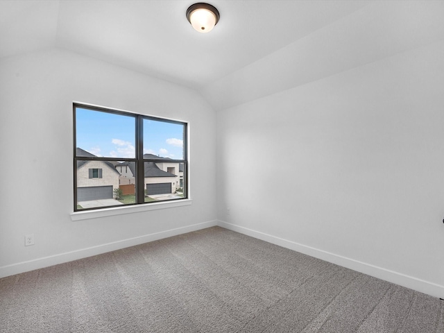 3248 Stingray Cove Dr, Katy, TX 77493 - empty room featuring baseboards, carpet floors, and vaulted ceiling