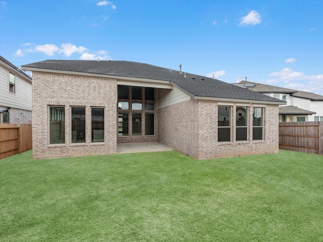 3248 Stingray Cove Dr, Katy, TX 77493 - rear view of house featuring brick siding, a lawn, and a fenced backyard