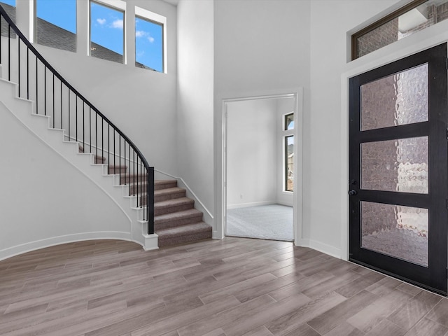 3248 Stingray Cove Dr, Katy, TX 77493 - entryway featuring stairway, a high ceiling, baseboards, and wood finished floors