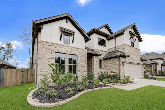 view of front of house with a front lawn and a garage